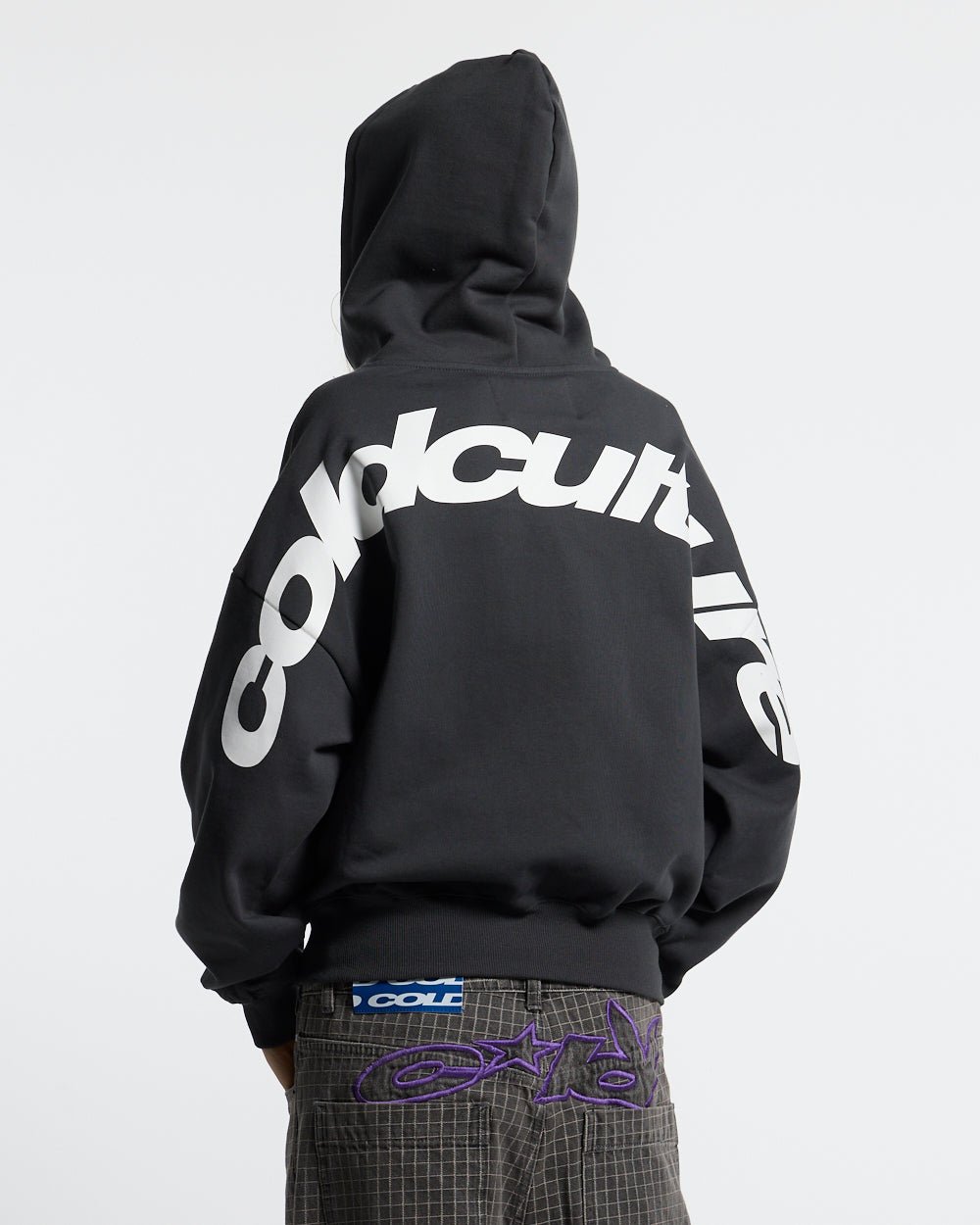 CURVED ZIP HOODIE INDIA INK - black logo print zip hoodie, back view on female model - Cold Culture #woman