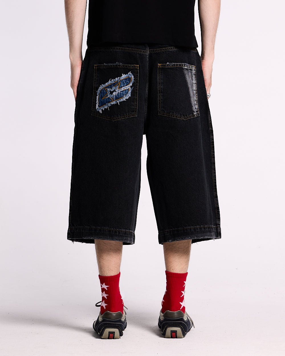 DARK SEA SHORT - baggy black denim shorts, back view on male model - Cold Culture