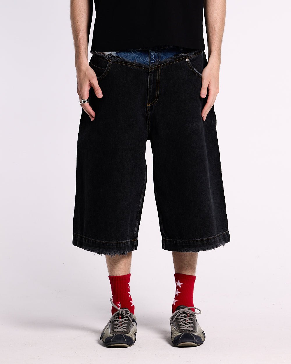 DARK SEA SHORT - baggy black denim shorts, front view on male model - Cold Culture