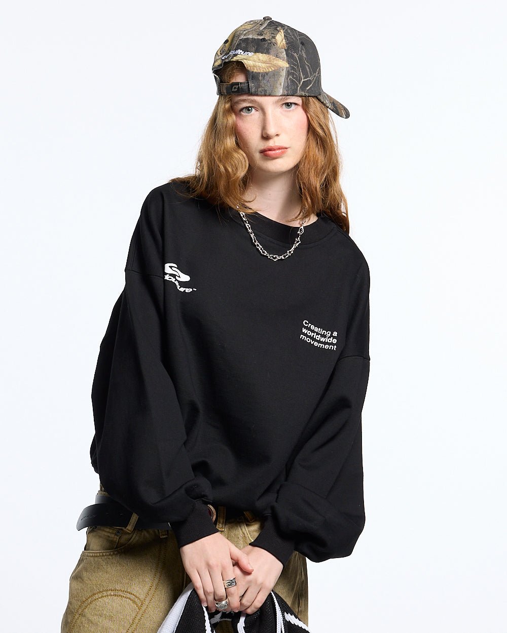 DEFENSE CREWNECK BLACK - black oversized crewneck sweatshirt, front view on female model - Cold Culture #woman