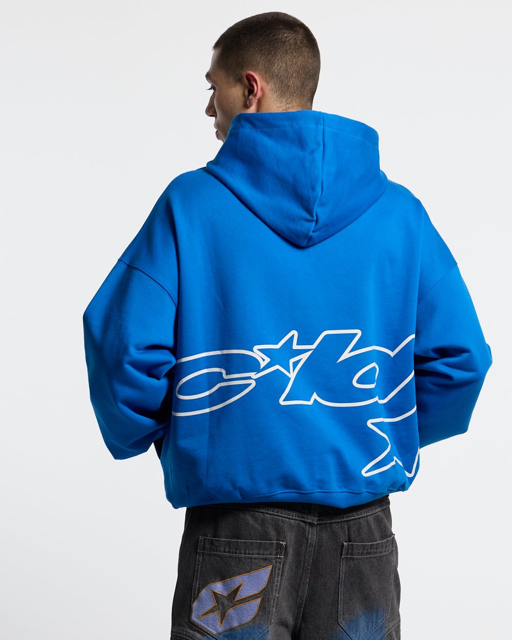 DEFENSE HOODIE ELECTRIC BLUE - royal blue graphic print hoodie, back view on male model - Cold Culture
