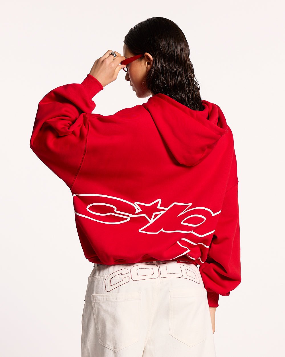 DEFENSE HOODIE RED - red graphic print hoodie, back view on female model - Cold Culture #woman