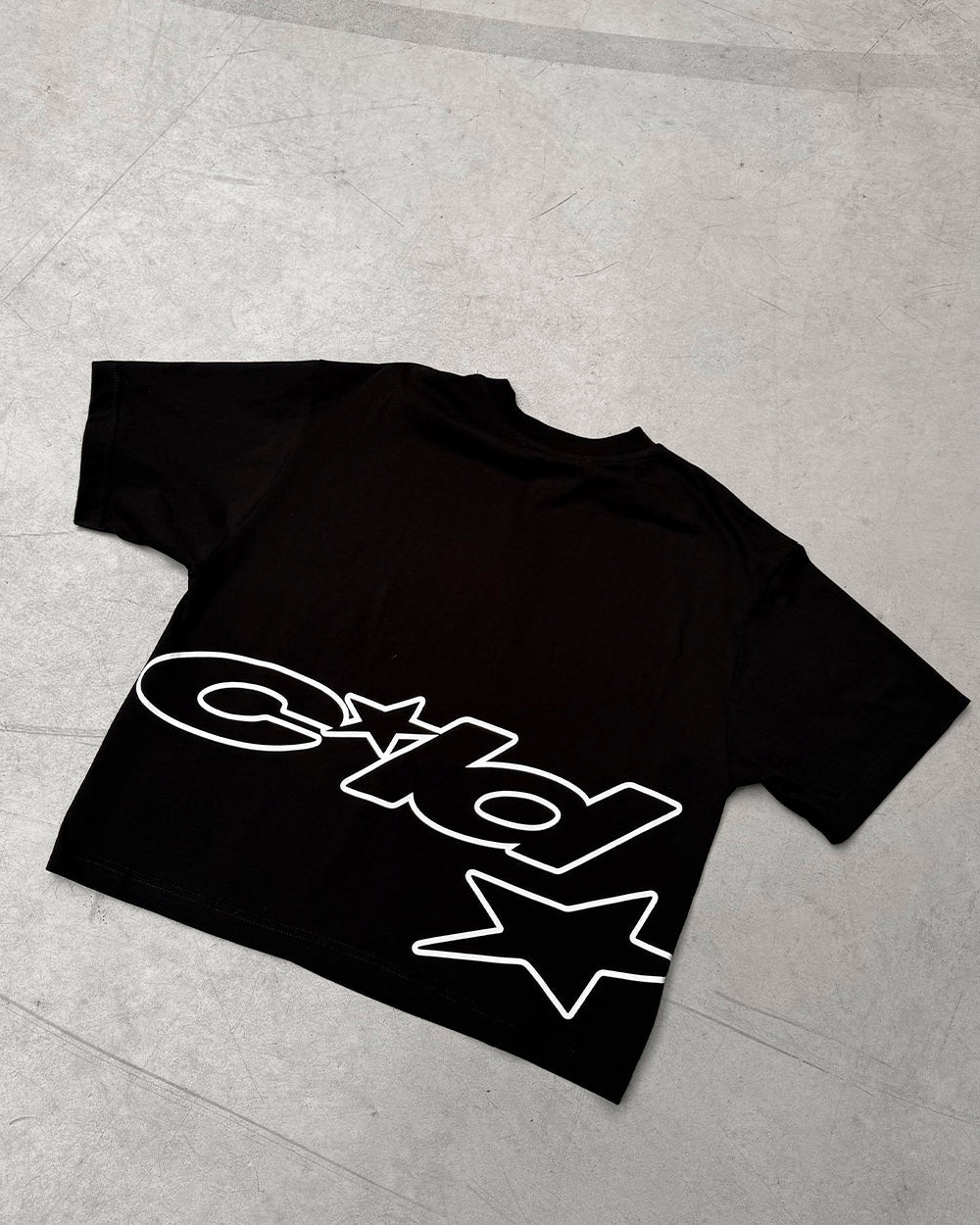 DEFENSE TEE BLACK - black oversized tee, flat lay - Cold Culture