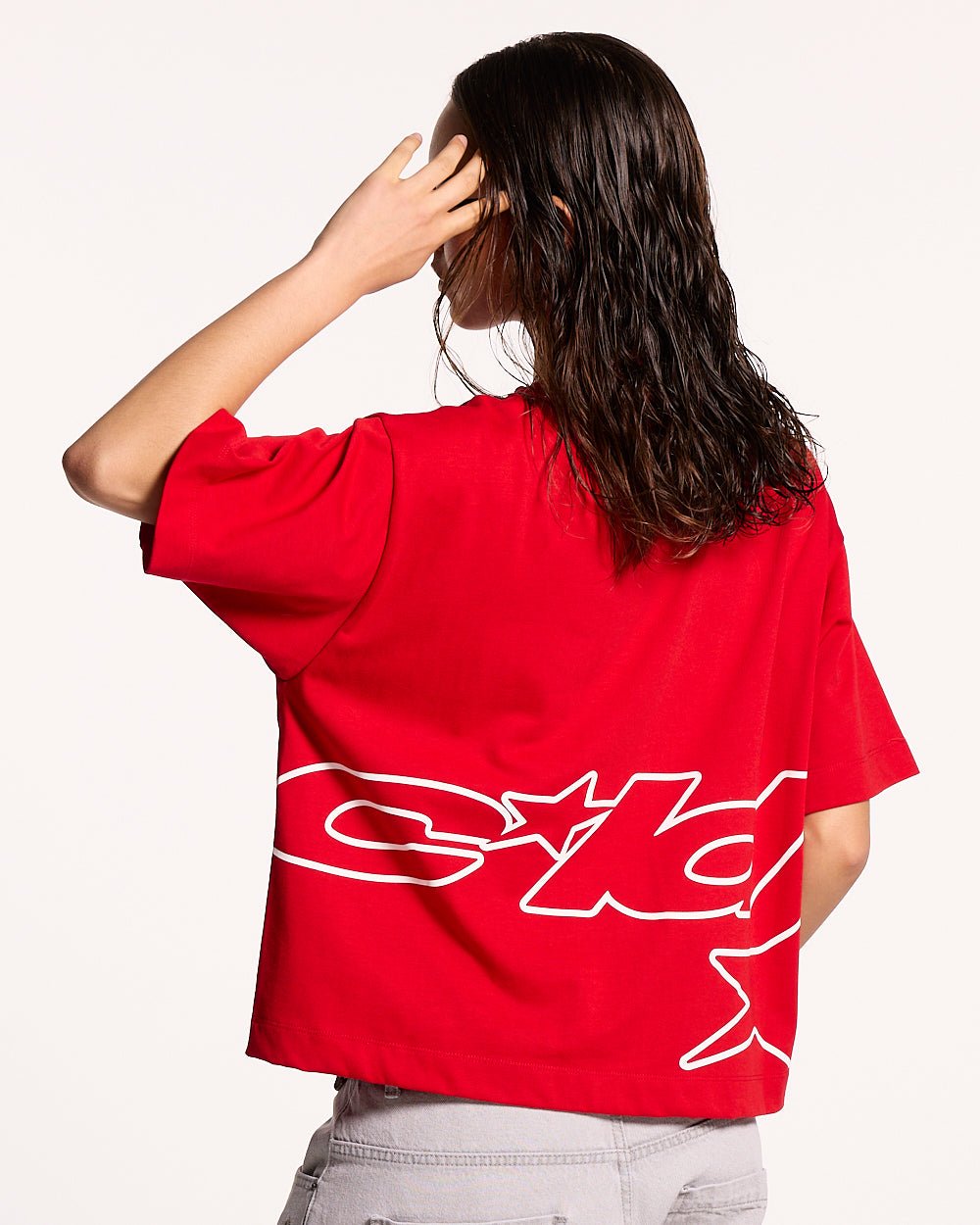 DEFENSE TEE RED - red graphic print tee, back view on female model - Cold Culture #woman