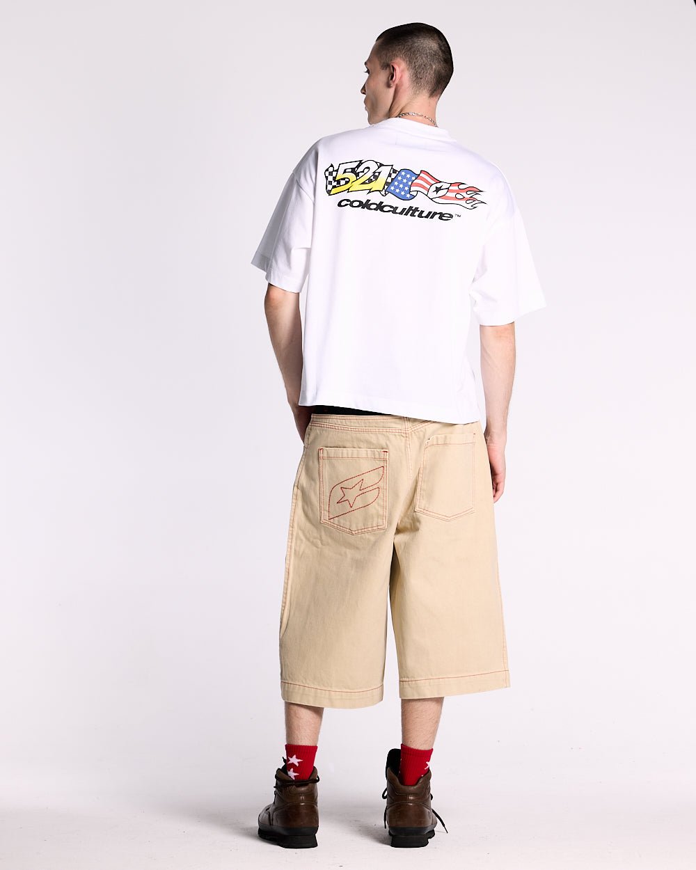 DESERT SHORT - baggy beige denim shorts, back view on male model - Cold Culture #man