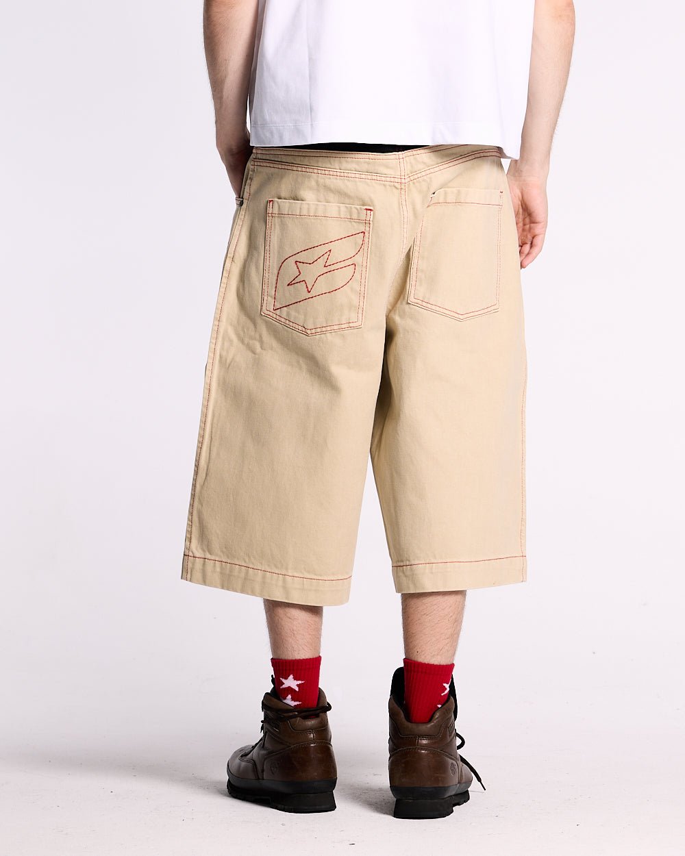 DESERT SHORT - baggy beige denim shorts, back view on male model - Cold Culture