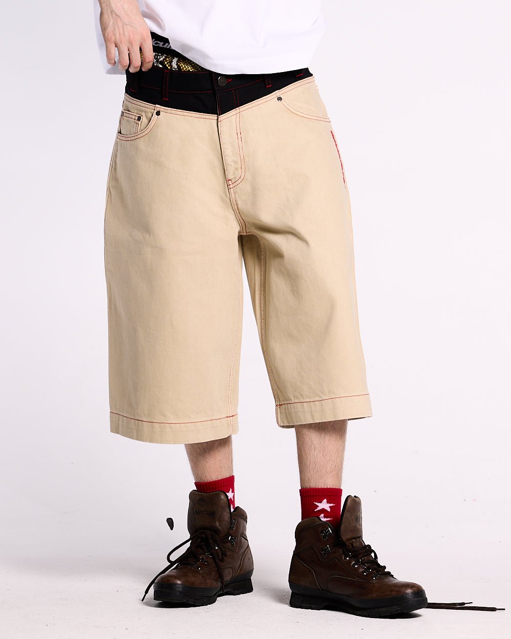 DESERT SHORT - baggy beige denim shorts, front view on male model - Cold Culture