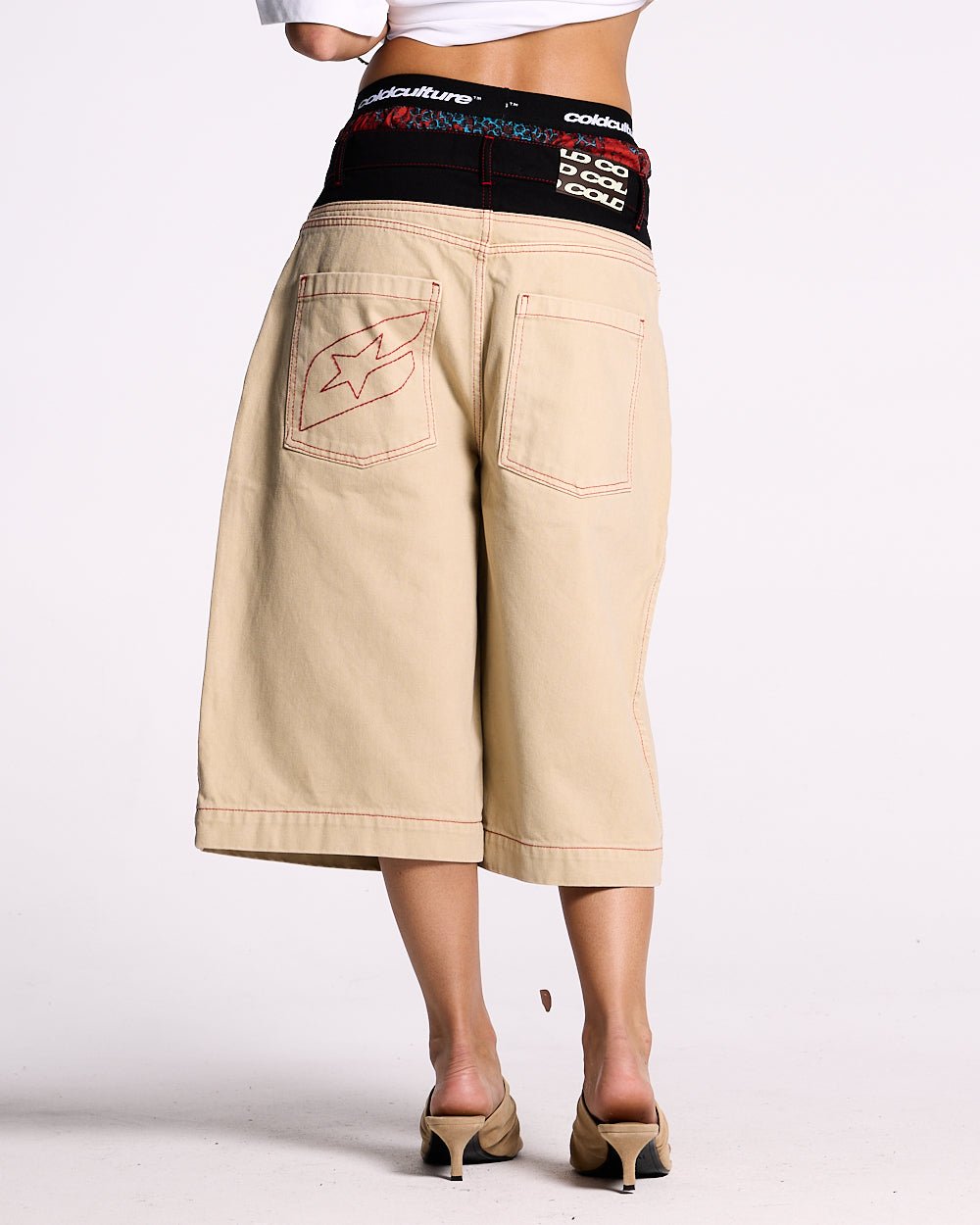 DESERT SHORT - baggy beige denim shorts, back view on female model - Cold Culture #woman