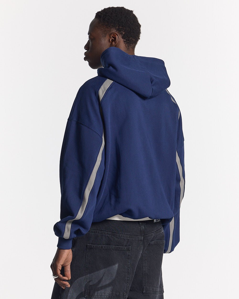 DETAILED HOODIE INDIGO BLUE - navy hoodie with contrast piping, back view on male model - Cold Culture #man
