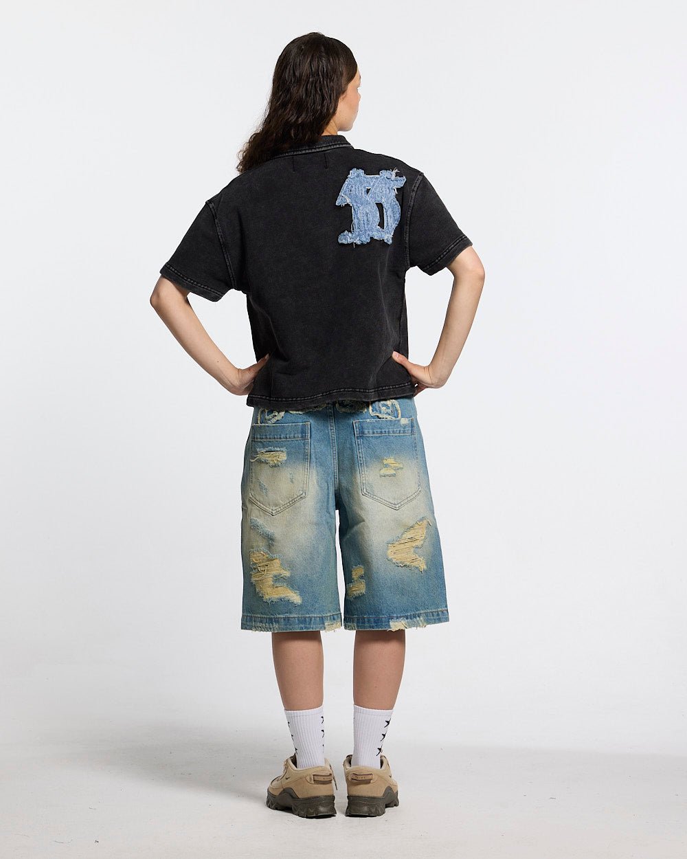 DISRUPT SHORTS LIGHT BLUE - light blue distressed denim shorts, back view on female model - Cold Culture #woman