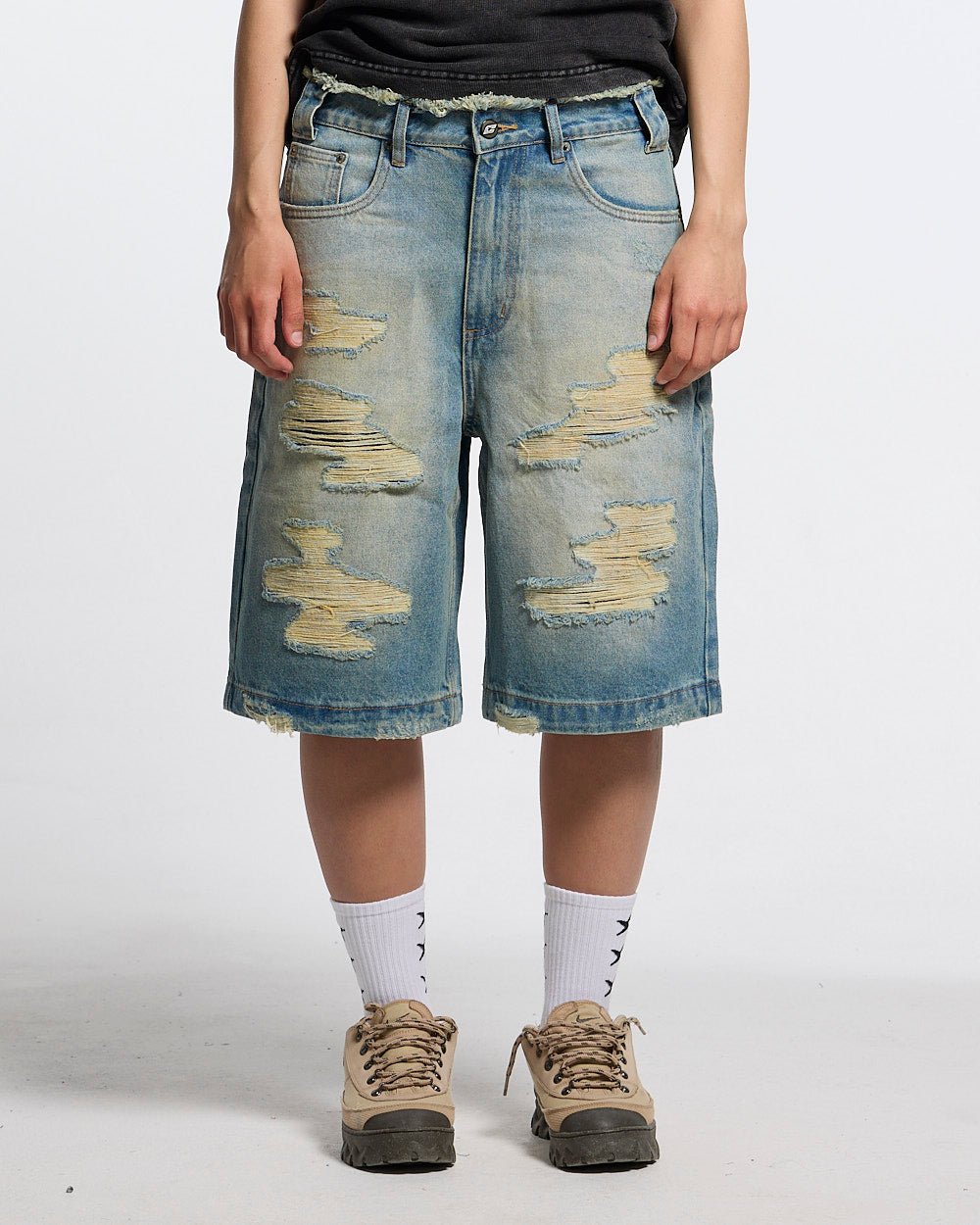 DISRUPT SHORTS LIGHT BLUE - light blue distressed denim shorts, front view on female model - Cold Culture #woman