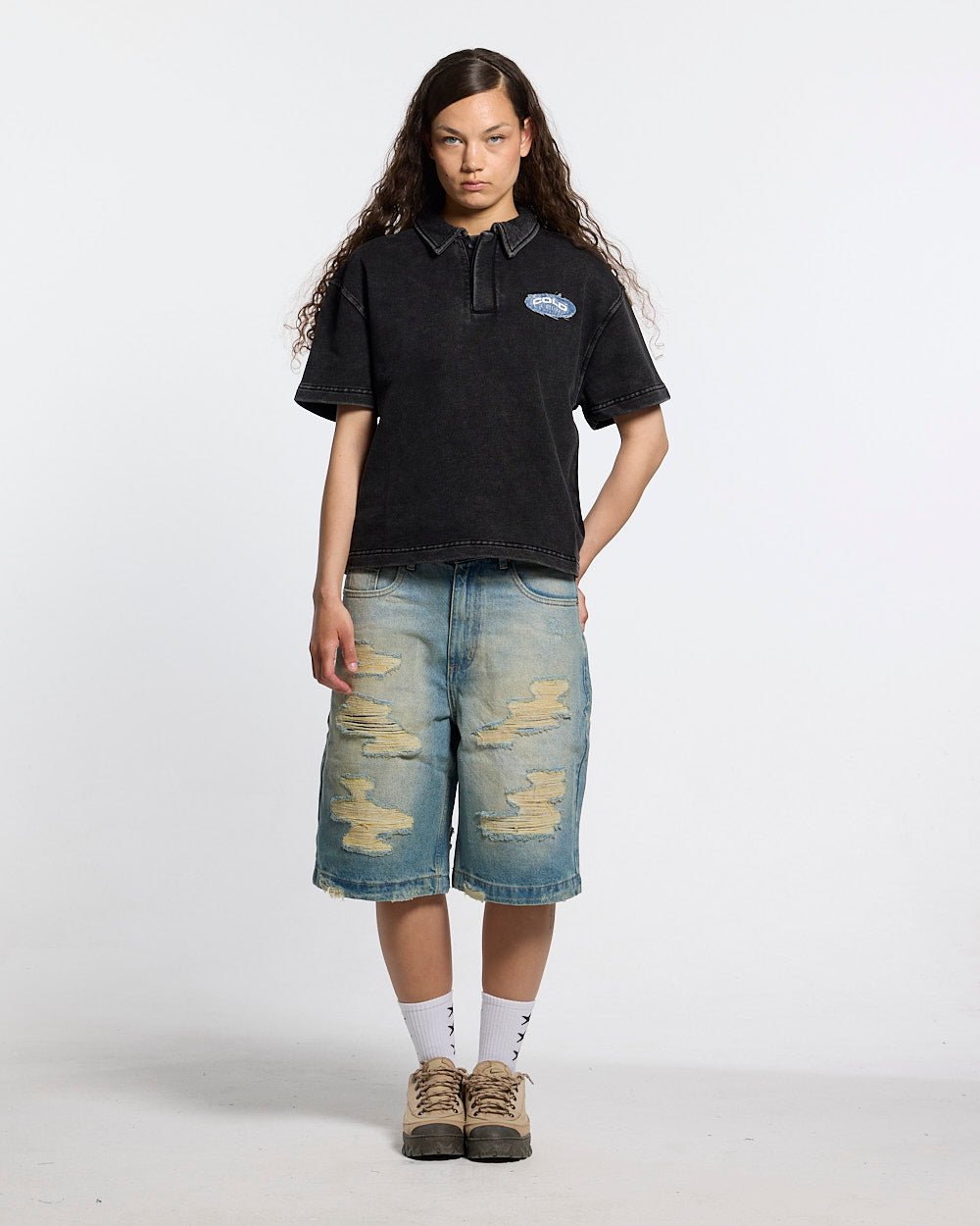 DISRUPT SHORTS LIGHT BLUE - light blue distressed denim shorts, front view on female model - Cold Culture #woman