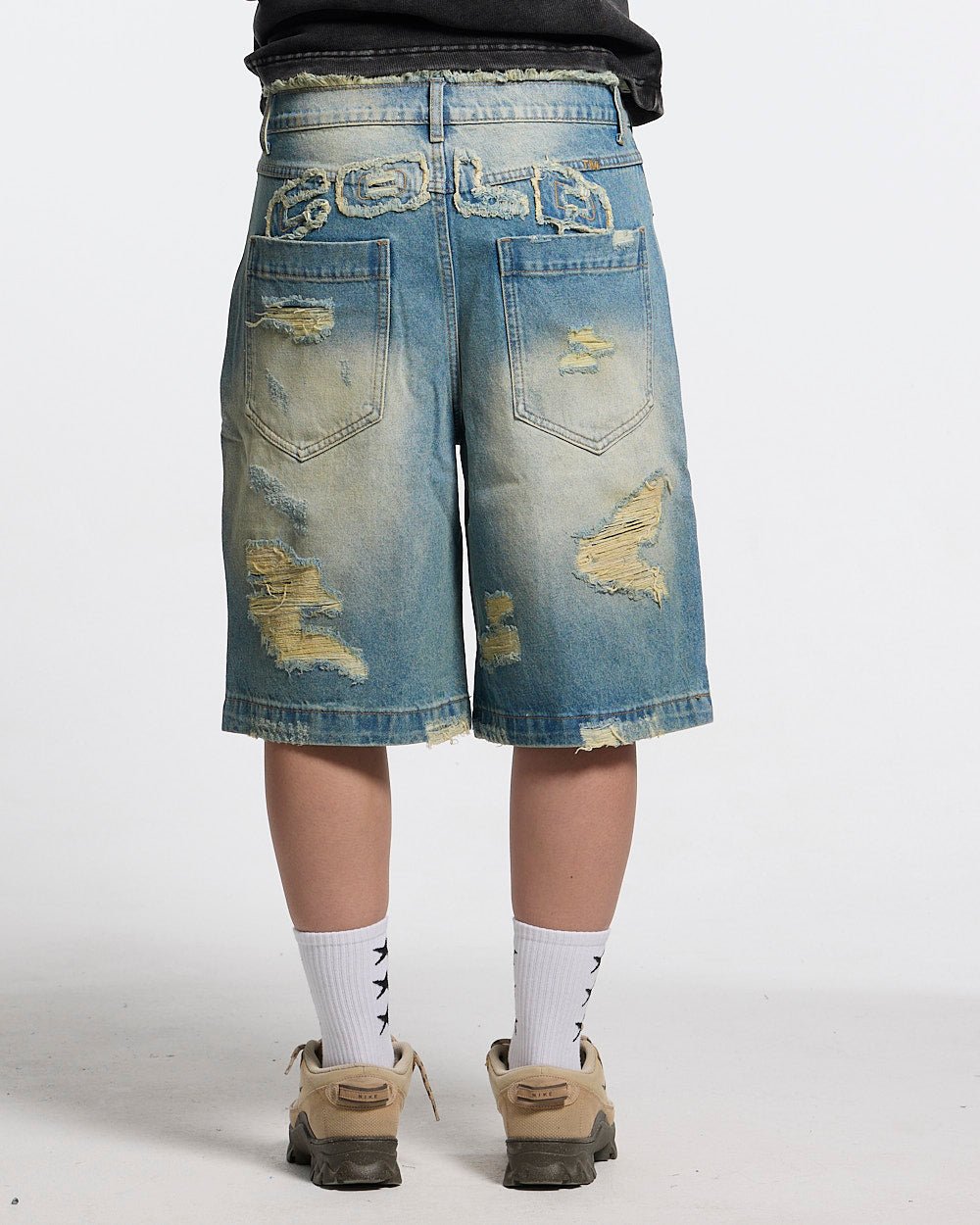 DISRUPT SHORTS LIGHT BLUE - light blue distressed denim shorts, back view on female model - Cold Culture #woman