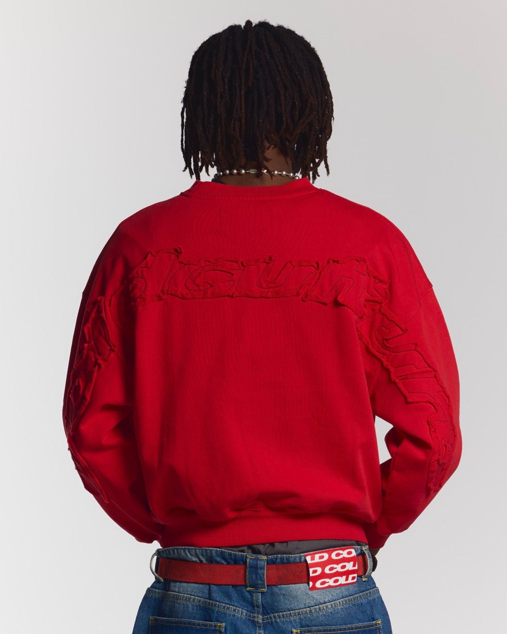 DISTRESS CURVED CREWNECK RED - red distressed crewneck sweatshirt, back view on male model - Cold Culture #man