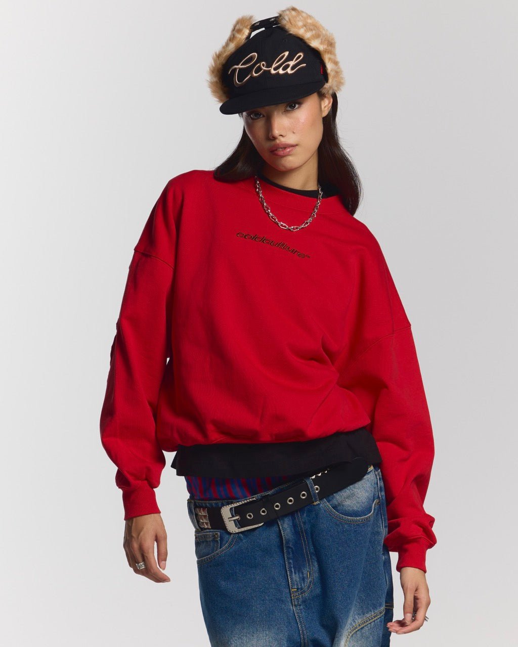 DISTRESS CURVED CREWNECK RED - red distressed crewneck sweatshirt, front view on female model - Cold Culture #woman