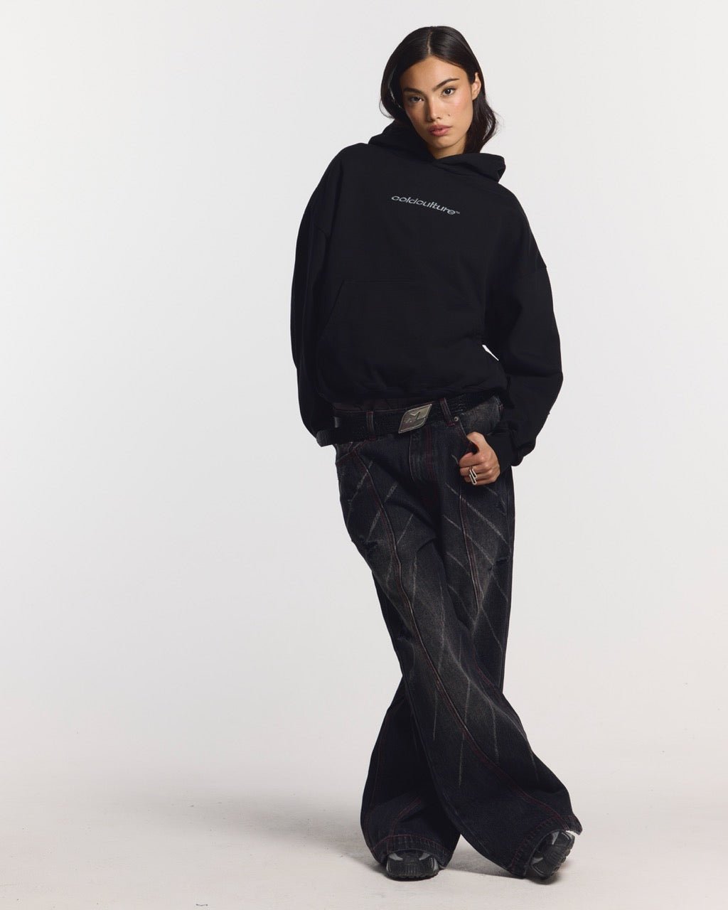 DISTRESS CURVED HOODIE BLACK - black distressed hoodie, front view on female model - Cold Culture #woman