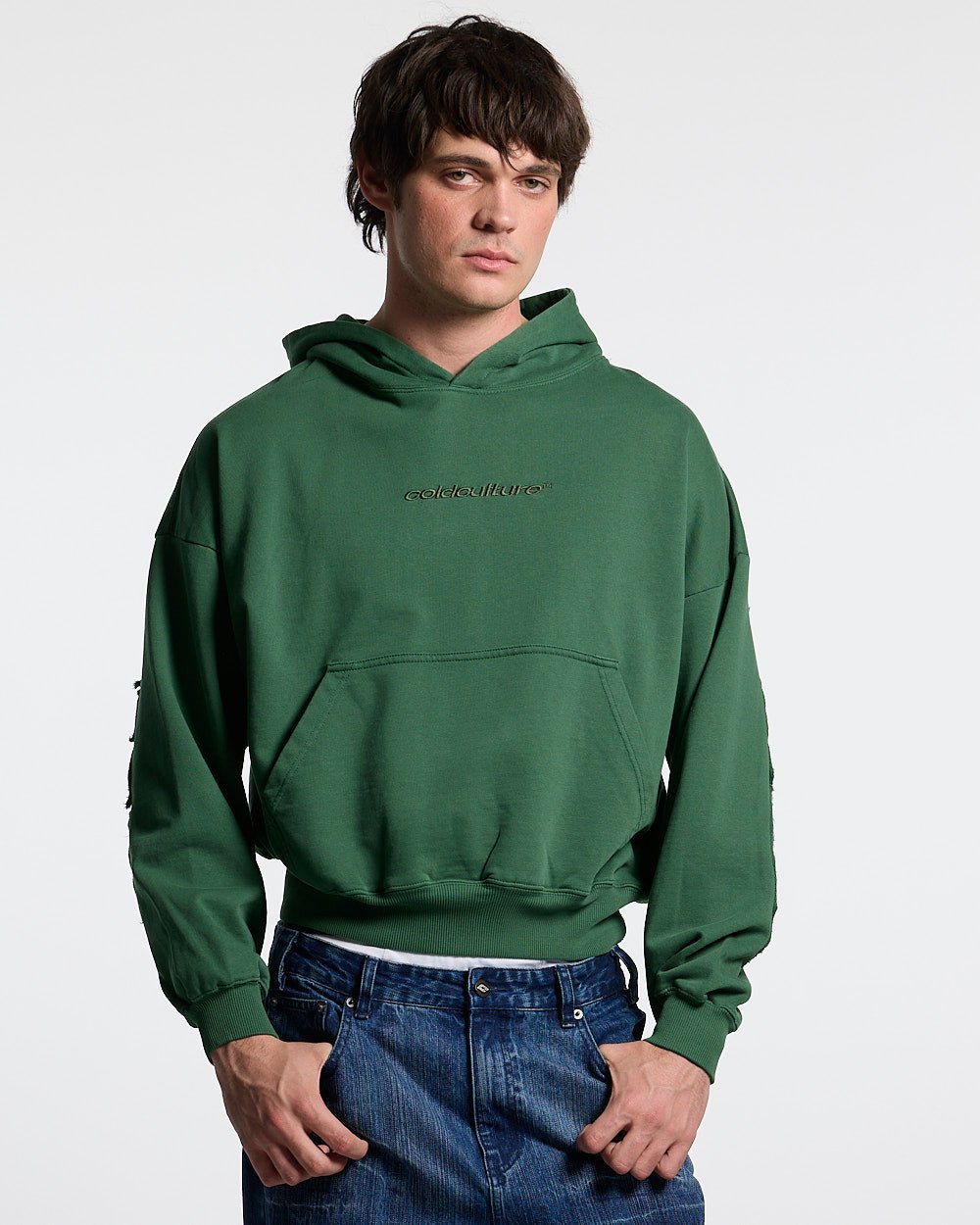 DISTRESS CURVED HOODIE GREEN - green distressed hoodie, front view on male model - Cold Culture #man