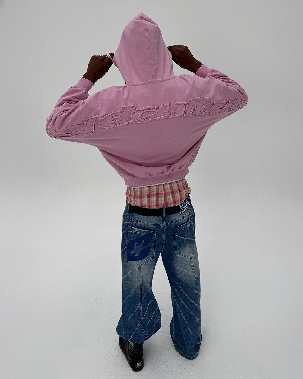 DISTRESS CURVED HOODIE PINK - pink distressed hoodie, back view on male model - Cold Culture
