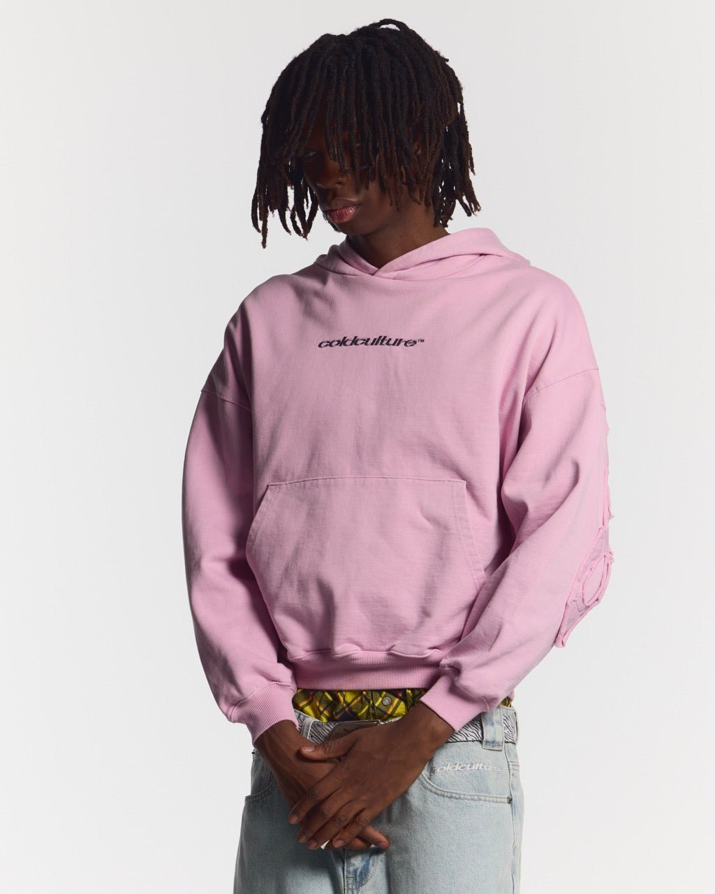DISTRESS CURVED HOODIE PINK - pink distressed hoodie, front view on male model - Cold Culture #man