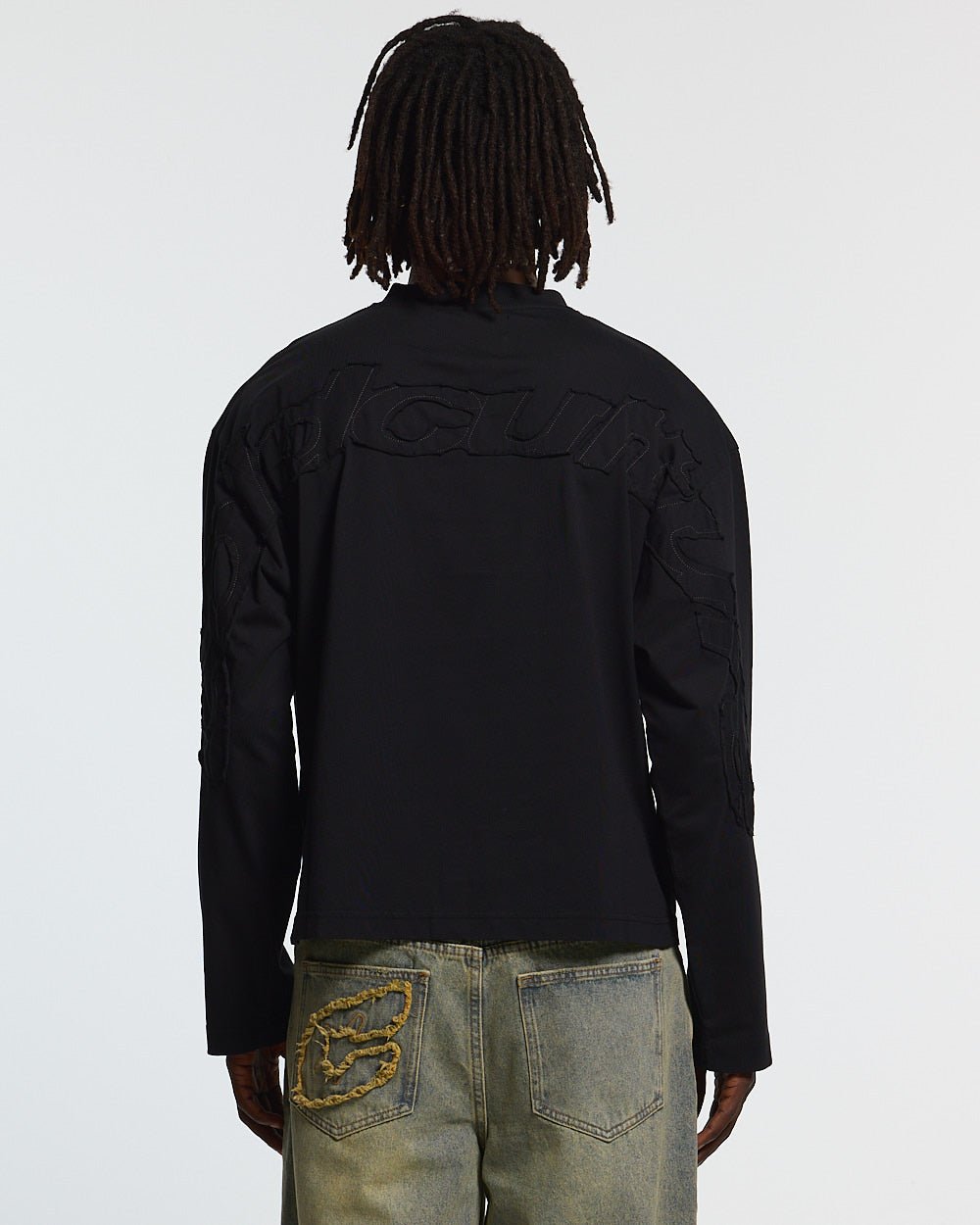 DISTRESS CURVED LONGSLEEVE BLACK - black distressed longsleeve tee, back view on male model - Cold Culture #man
