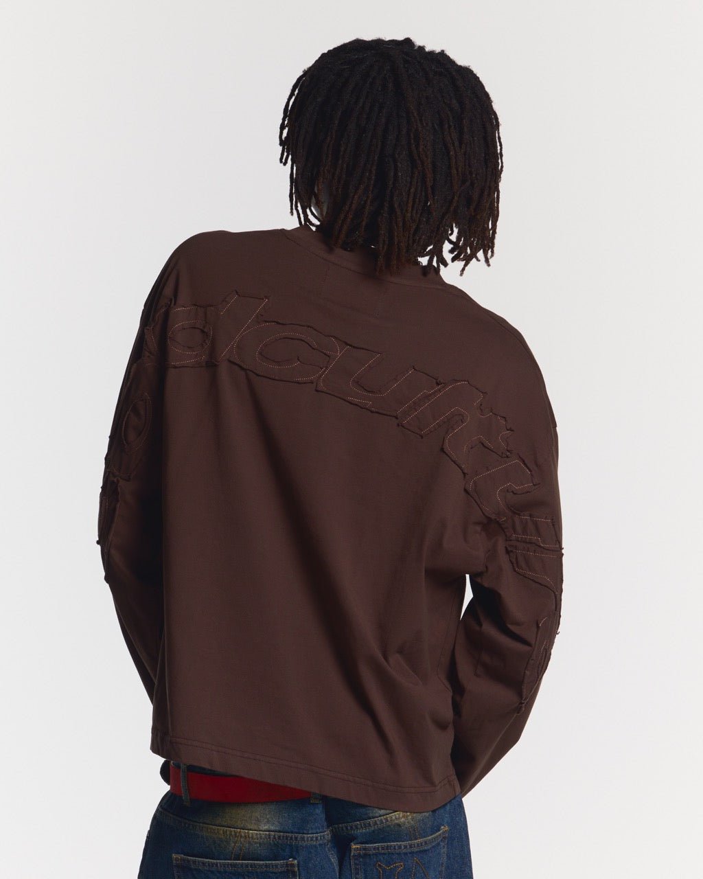 DISTRESS CURVED LONGSLEEVE BROWN - brown distressed longsleeve tee, back view on male model - Cold Culture #man