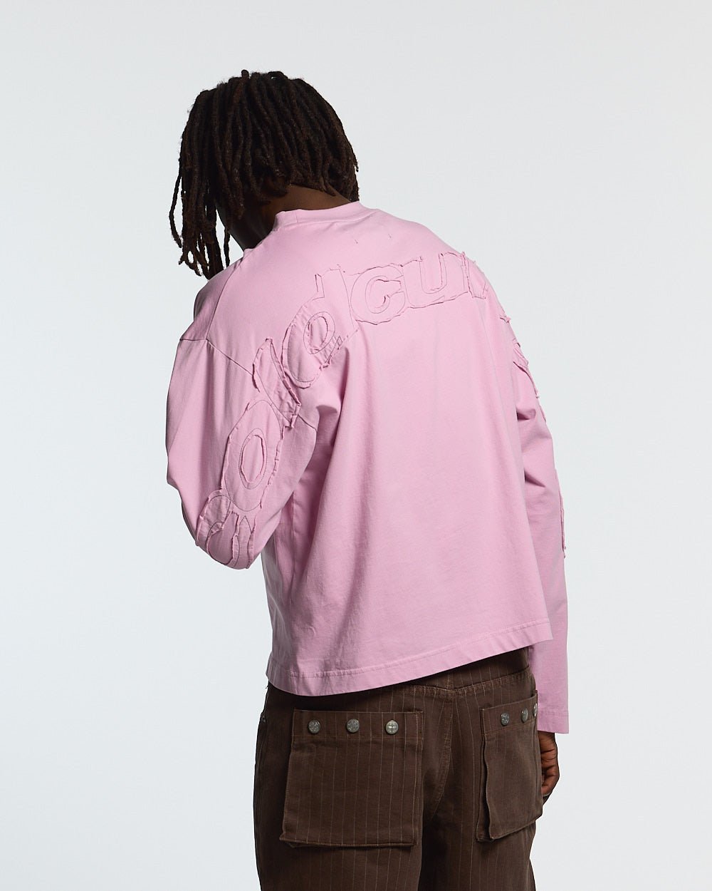 DISTRESS CURVED LONGSLEEVE PINK - pink distressed longsleeve tee, back view on male model - Cold Culture #man