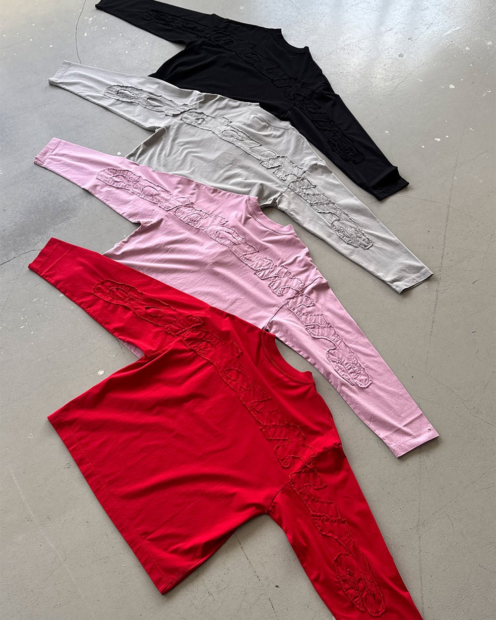DISTRESS CURVED LONGSLEEVE RED - red distressed longsleeve tee, flat lay with matching pieces - Cold Culture