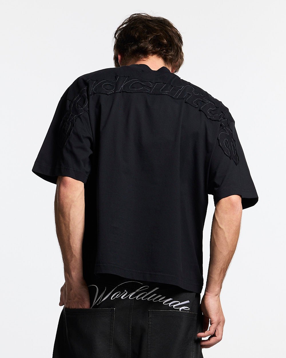 DISTRESS CURVED TEE BLACK - black distressed tee, back view on male model - Cold Culture #man