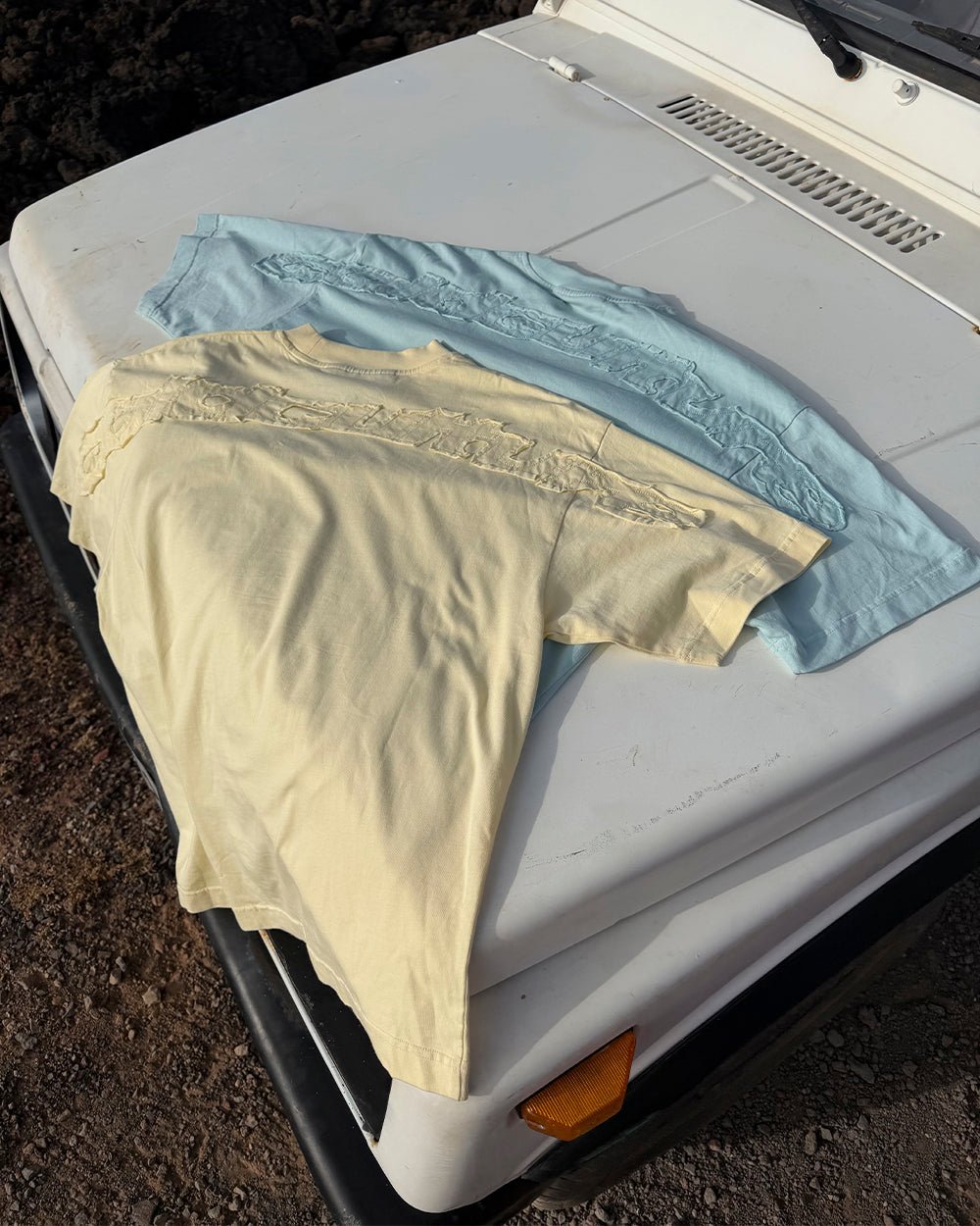 DISTRESS CURVED TEE BLUE - light blue distressed logo tee, flat lay with matching pieces - Cold Culture