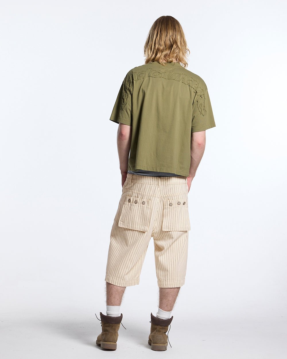 DISTRESS CURVED TEE GREEN - olive green boxy tee, back view on male model - Cold Culture #man