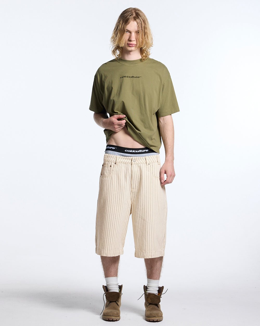 DISTRESS CURVED TEE GREEN - olive green boxy tee, front view on male model - Cold Culture #man