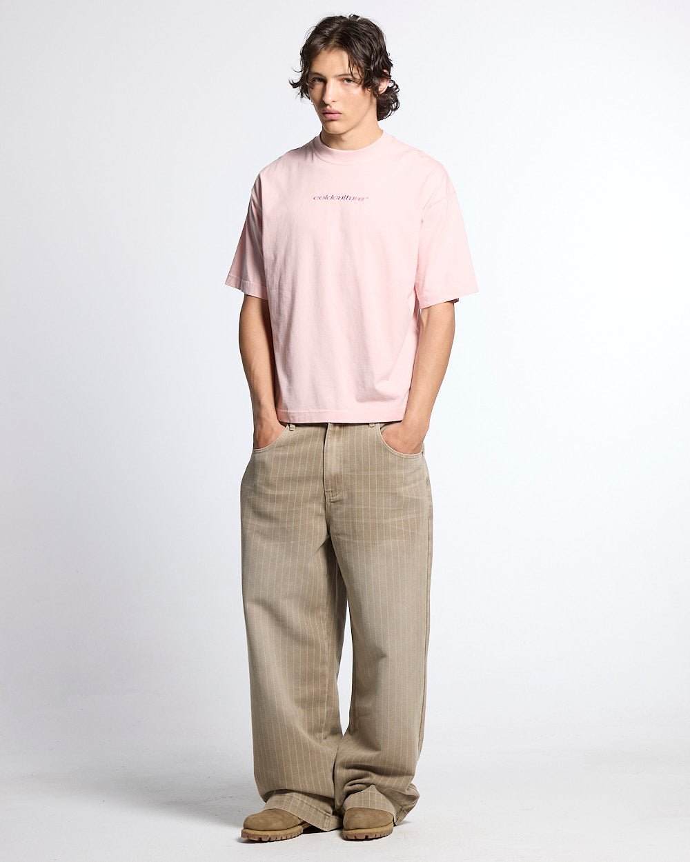 DISTRESS CURVED TEE PINK - pink distressed logo tee, front view on male model - Cold Culture #man