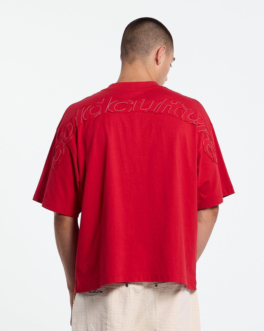 DISTRESS CURVED TEE RED - red distressed tee, back view on male model - Cold Culture #man