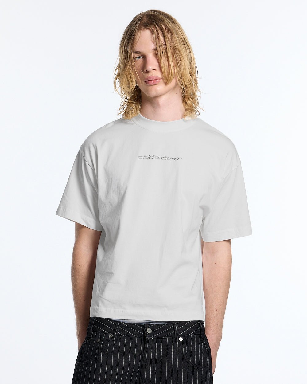 DISTRESS CURVED TEE WHITE - white boxy tee, front view on male model - Cold Culture #man