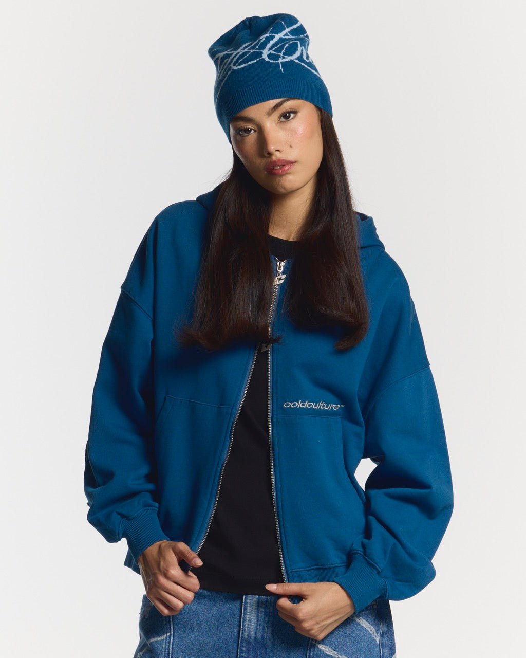 DISTRESS CURVED ZIP HOODIE DARK BLUE - dark blue distressed zip-up hoodie, front view on female model - Cold Culture #woman