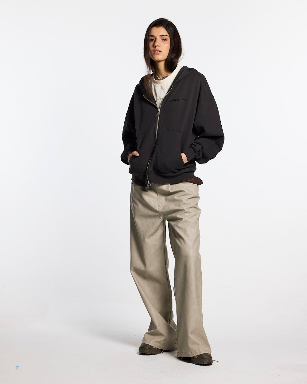 DISTRESS CURVED ZIP HOODIE DARK GREY - dark grey distressed zip-up hoodie, front view on female model - Cold Culture #woman