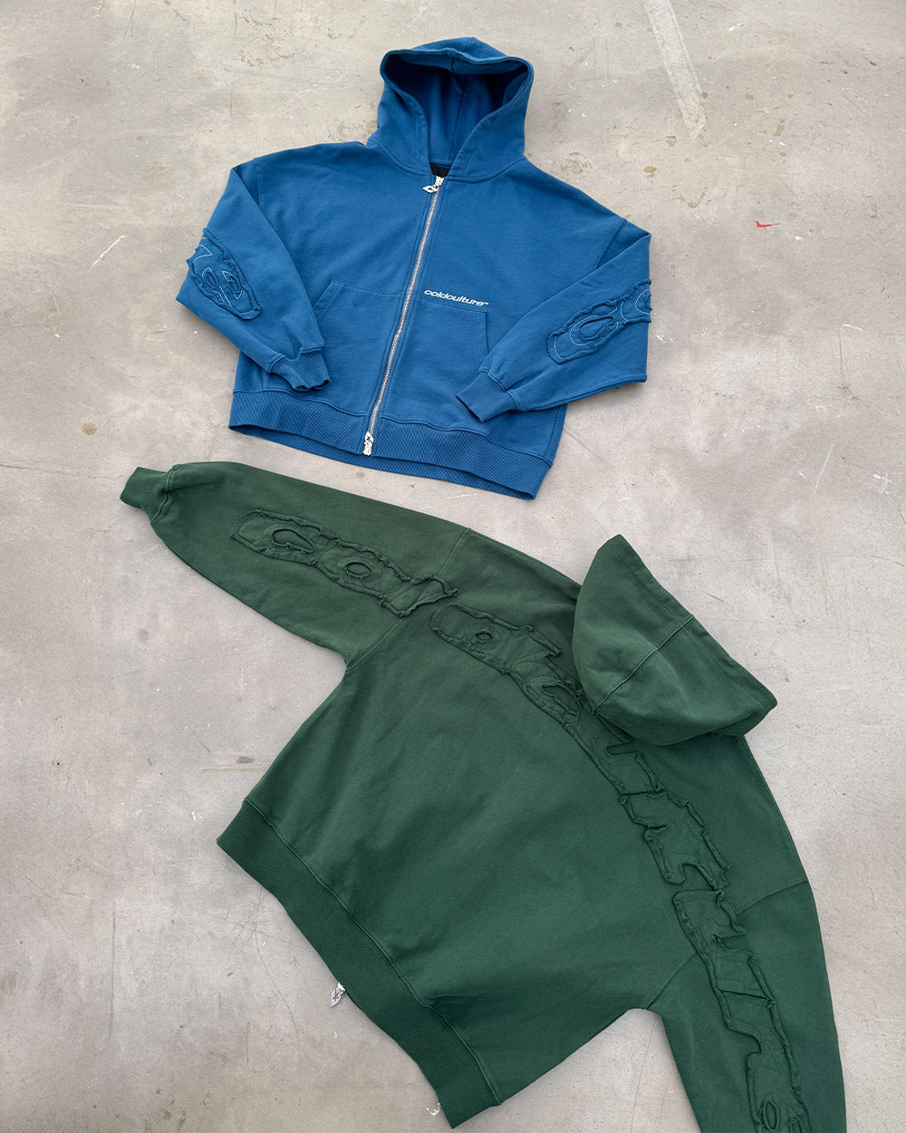 DISTRESS CURVED ZIP HOODIE GREEN - green distressed zip-up hoodie, flat lay with matching pieces - Cold Culture