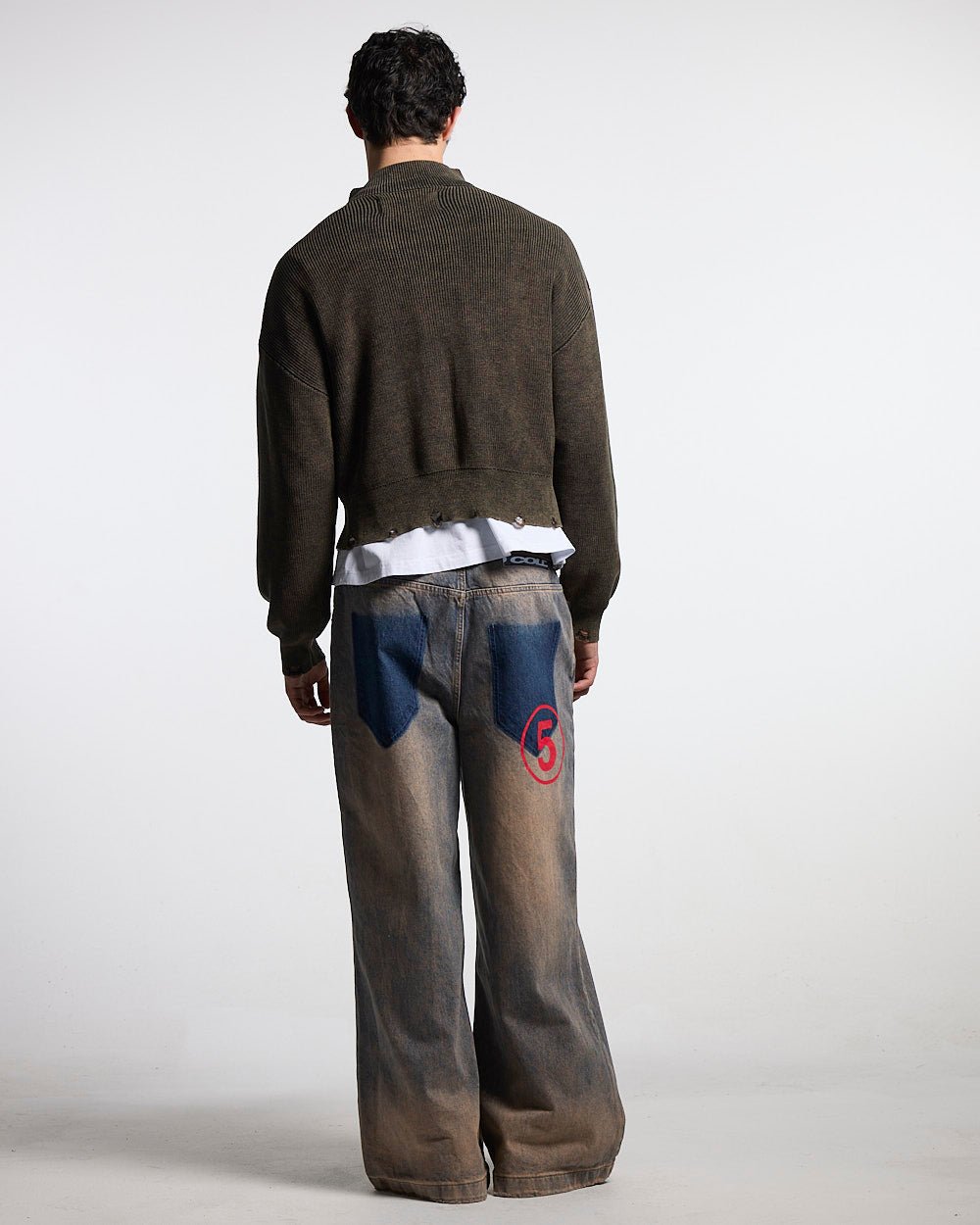 DISTRESS CURVED ZIP KNIT BLACK - black washed zip knit sweater, back view on male model - Cold Culture #man