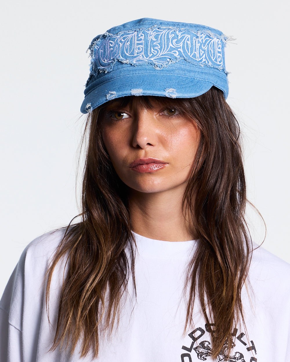 DISTRESS GOTHIC CAP DENIM - blue distressed denim cap, on model close-up - Cold Culture
