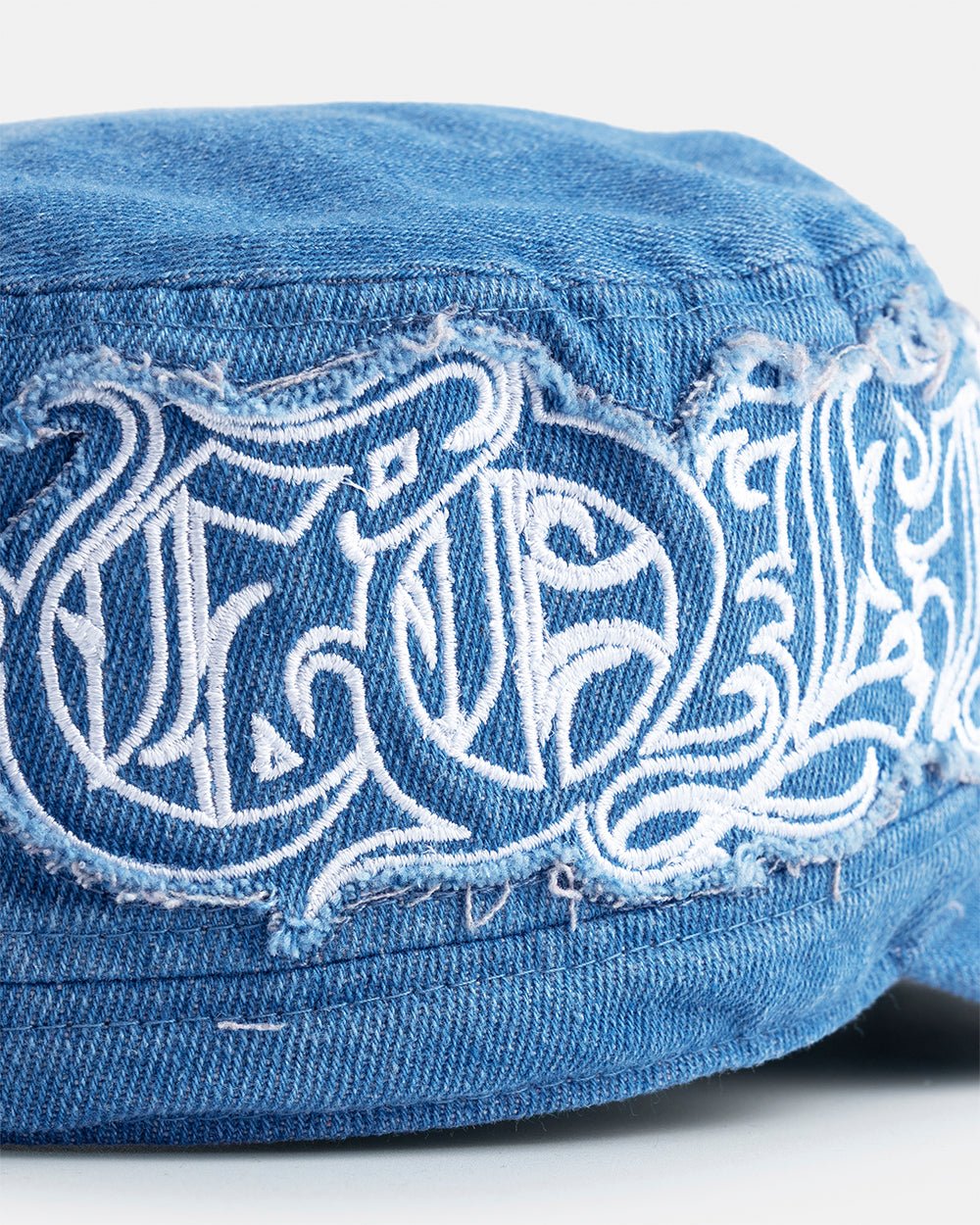 DISTRESS GOTHIC CAP DENIM - blue distressed denim cap, detail close-up - Cold Culture