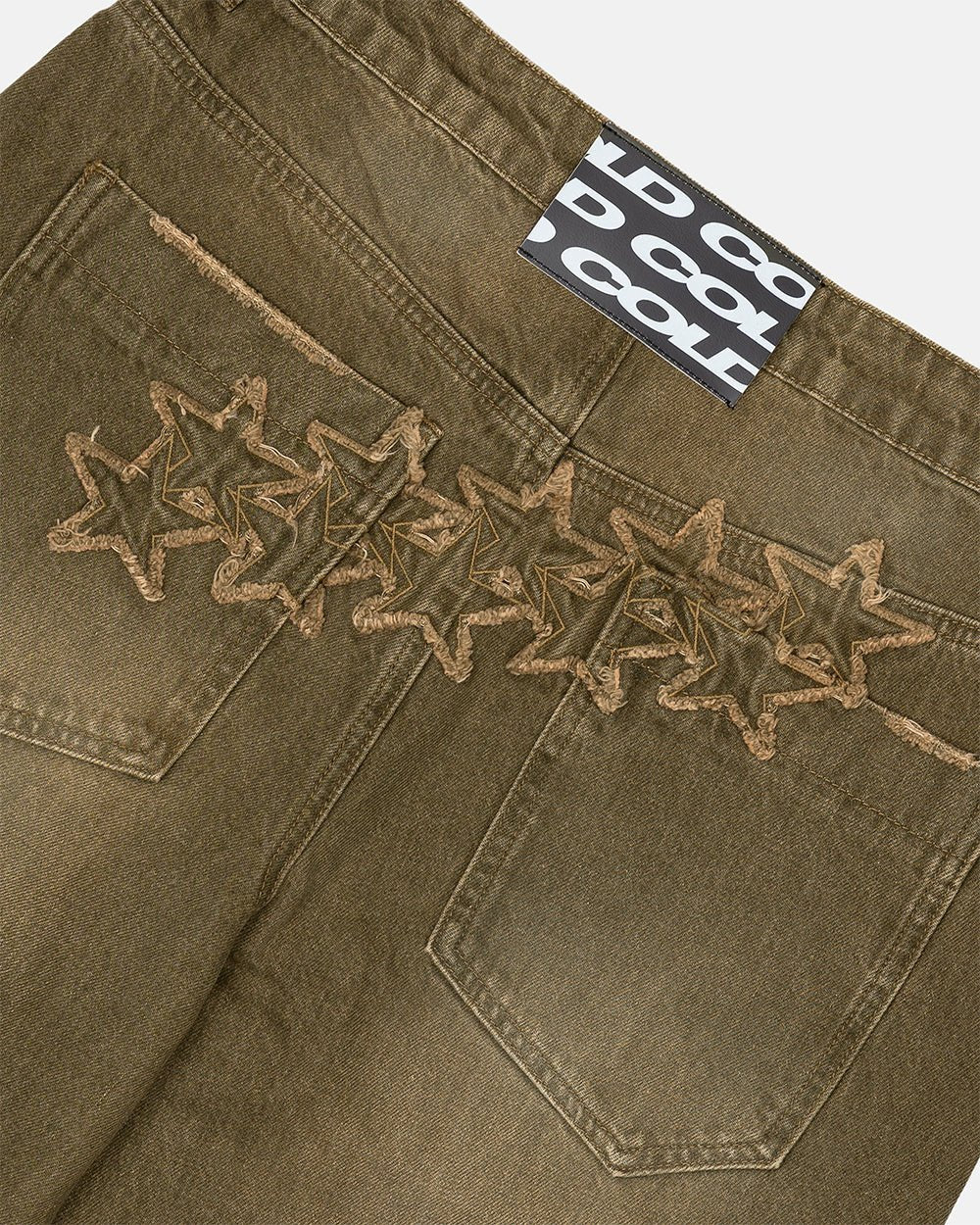 DISTRESS STARS V2 PANTS BROWN DENIM - brown washed denim pants, detail close-up - Cold Culture