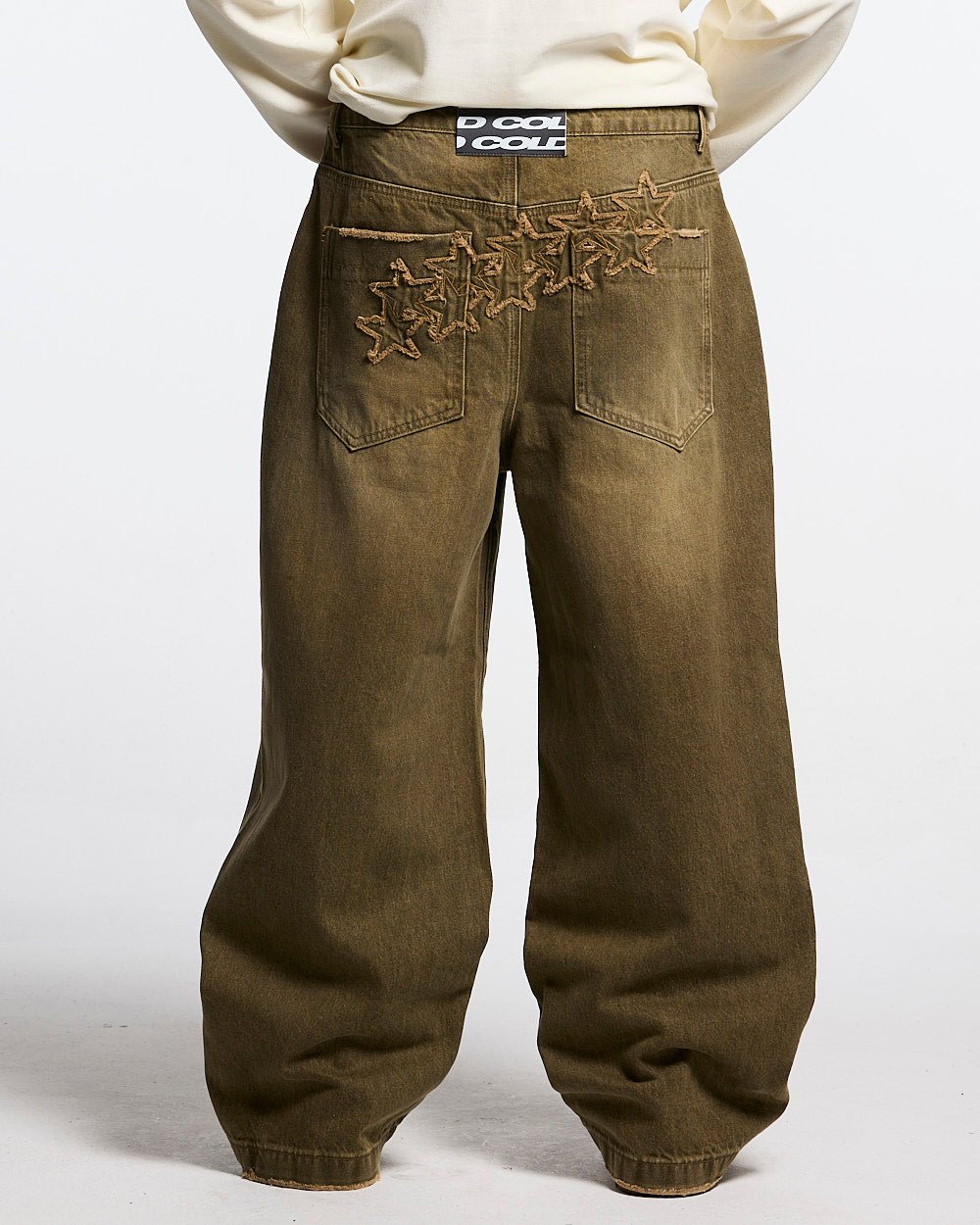 DISTRESS STARS V2 PANTS BROWN DENIM - brown washed denim pants, back view on male model - Cold Culture