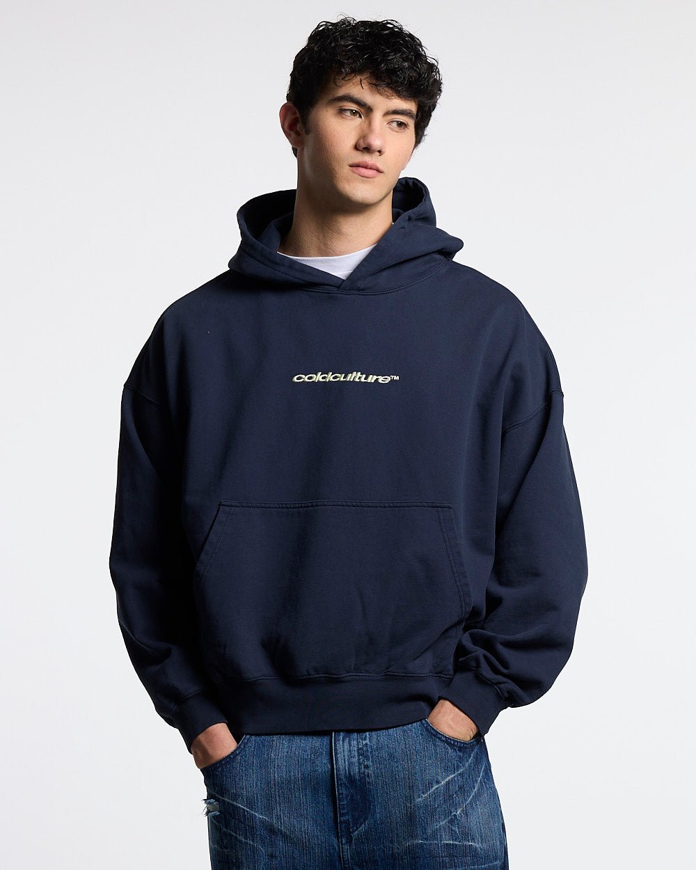 DISTRESSED DEFENSE HOODIE NAVY - navy distressed hoodie, front view on male model - Cold Culture #man
