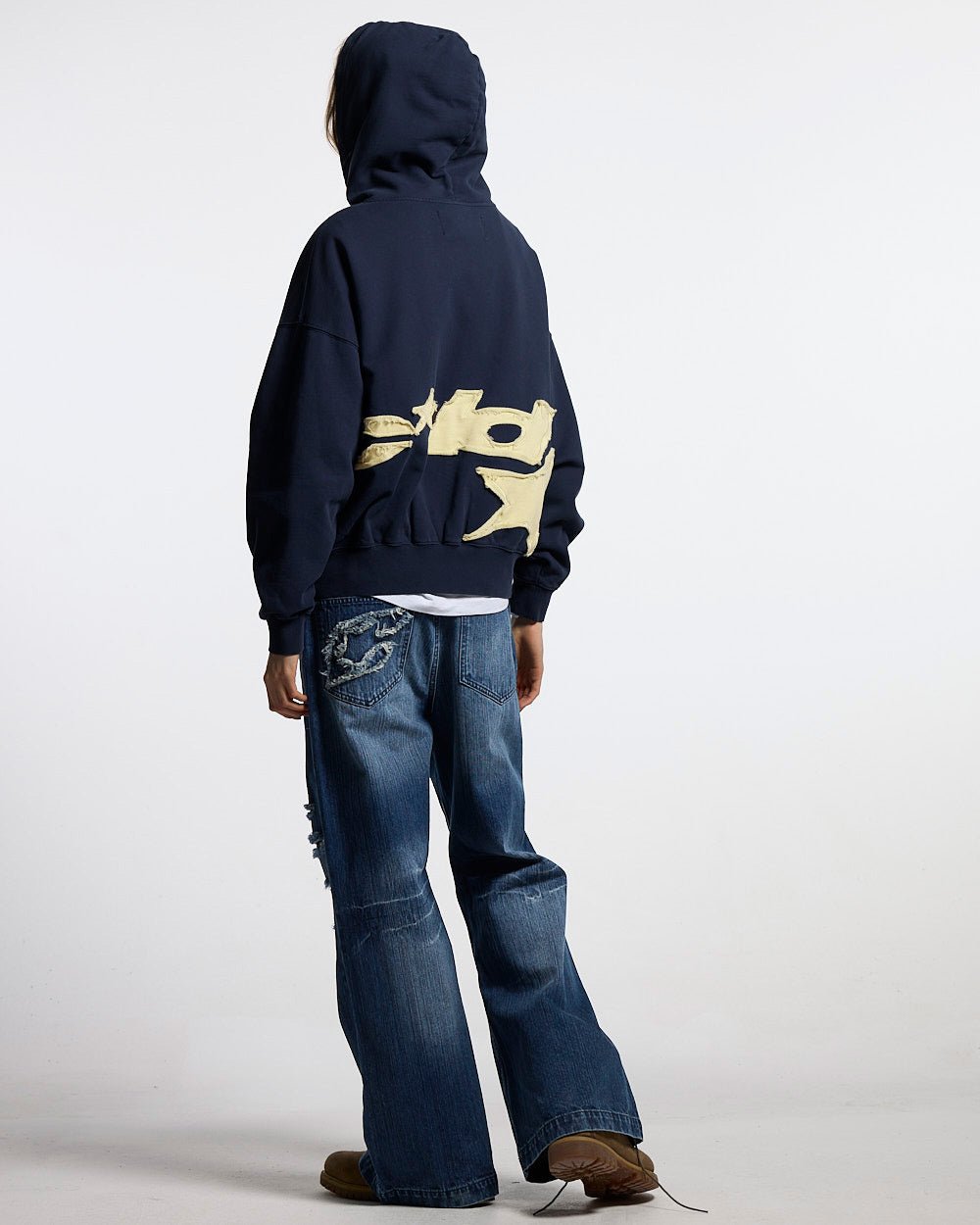 DISTRESSED DEFENSE HOODIE NAVY - navy distressed hoodie, back view on female model - Cold Culture #woman