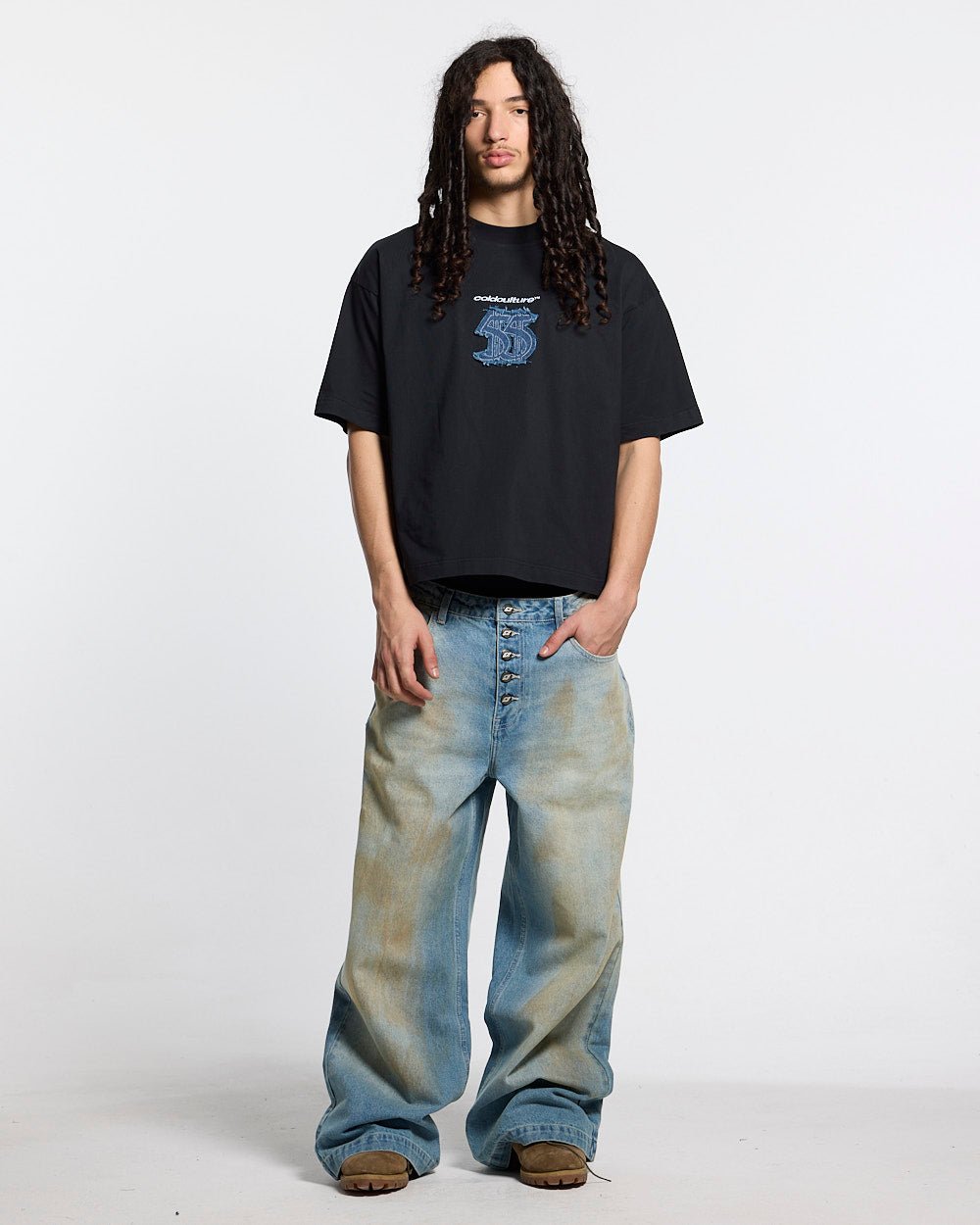 DISTRESSED DOLLAR TEE BLACK - black tee with denim applique, front view on male model - Cold Culture #man