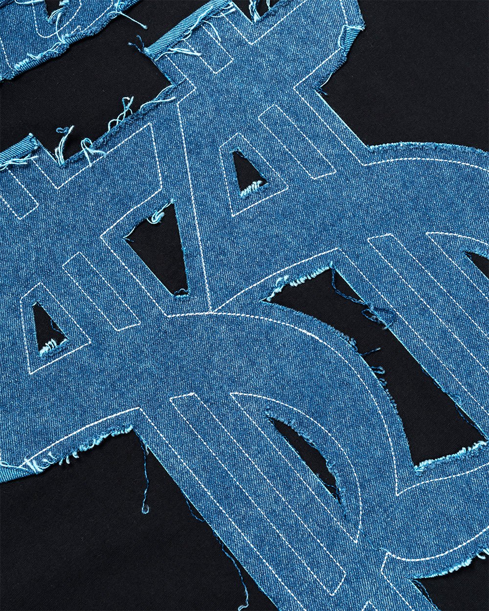 DISTRESSED DOLLAR TEE BLACK - black tee with denim applique, detail close-up - Cold Culture