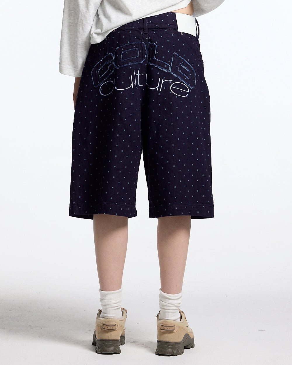 DOT CLUB SHORTS BLACK - black polka dot shorts, back view on female model - Cold Culture #woman