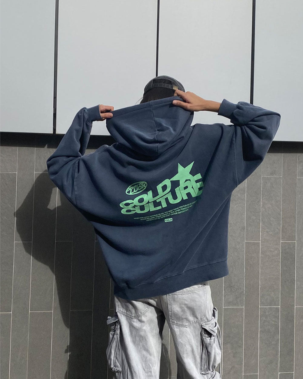 DOWN TO LUCK HOODIE - washed navy graphic print hoodie, street style shot - Cold Culture