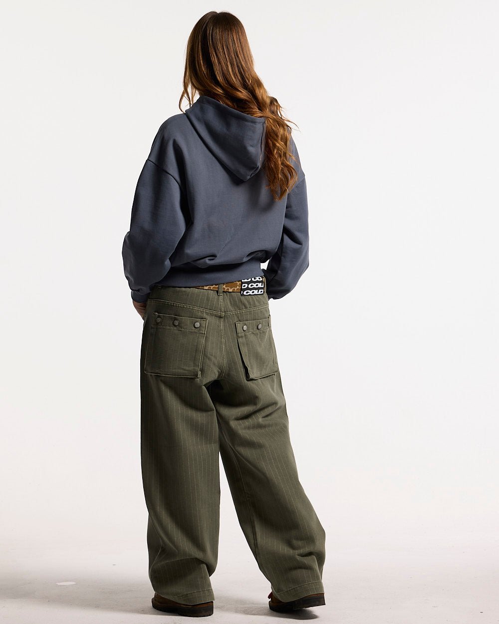 DRIVEN ZIP HOODIE INDIGO BLUE - indigo blue zip-up hoodie, back view on female model - Cold Culture #woman