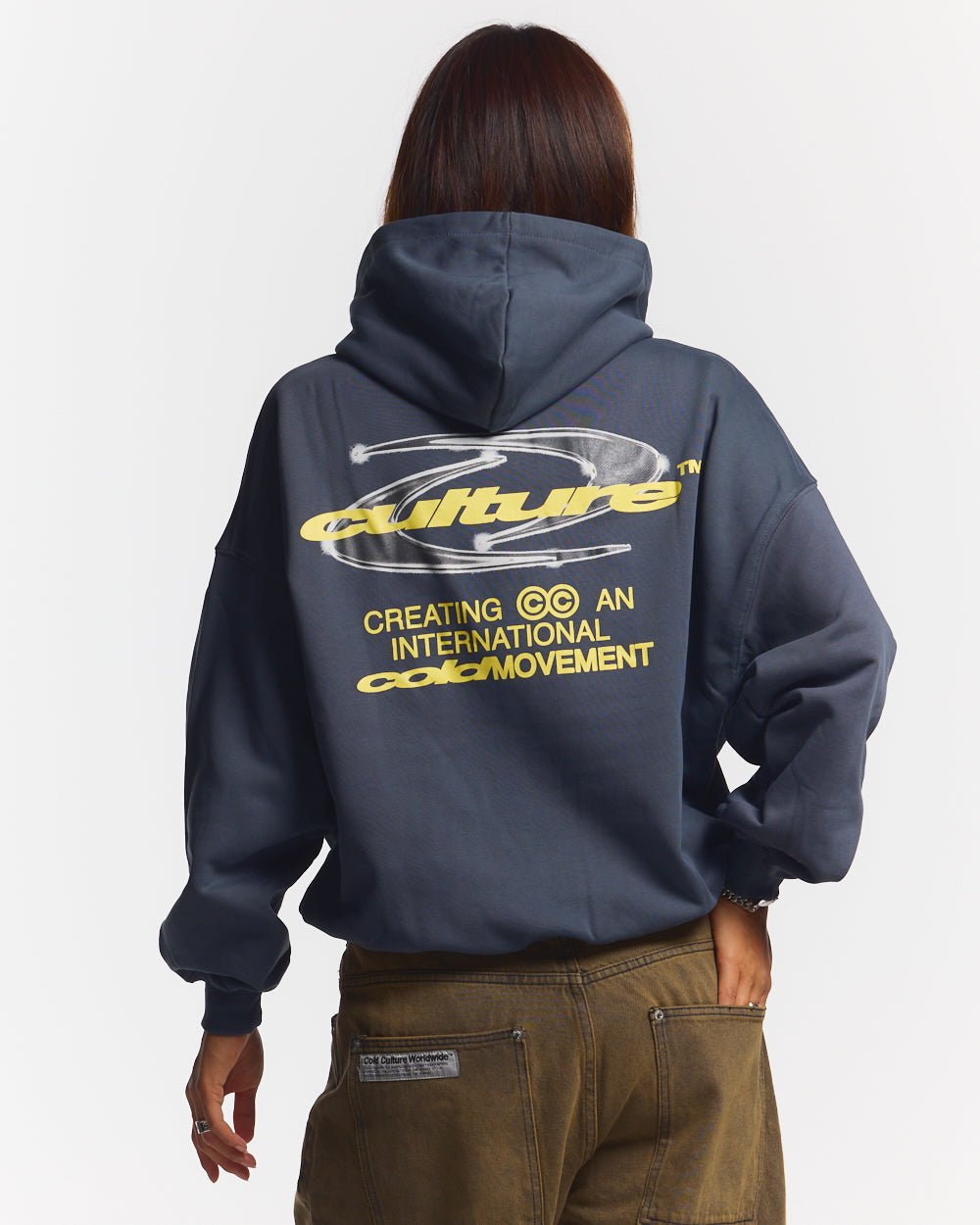 DYNAMIC HOODIE DARK BLUE - dark navy graphic print hoodie, back view on female model - Cold Culture #woman
